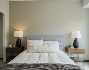 South St. Paul apartment for rent - Bedroom with cozy bed and lamps1 at The Yards, South St. Paul, MN