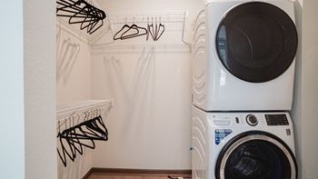 A washing machine and dryer in a laundry room