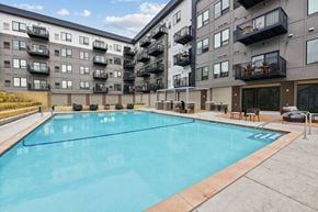 South St. Paul apartment for rent - a swimming pool in front of an apartment building