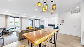 Minneapolis apartment for rent - A modern dining room with a wooden table and chairs.