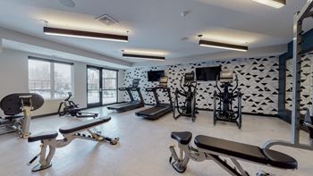 A fitness center with treadmills and other exercise equipment