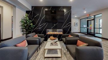 Rosemount apartment for rent - a living room with couches and a television and a fireplace
