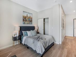 Minneapolis apartment for rent - Bedroom with a Painting on the Wall at Timber & Tie Apartments, Minneapolis