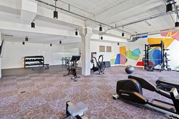 A gym with exercise equipment 