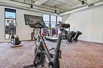 A gym with bikes and other exercise equipment