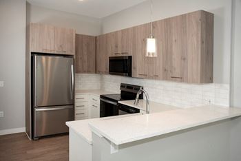 Nordic kitchen with breakfast bar perfect for bar stools and eating space