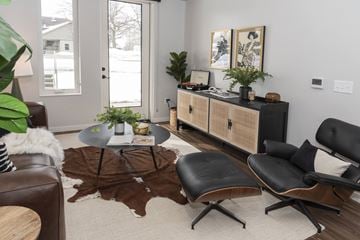 St Louis Park apartment for rent - a living room with a couch and a chair and a table