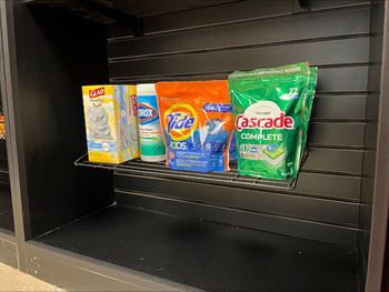 A display of laundry detergent and fabric softener.