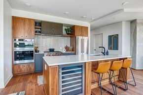 Minneapolis apartment for rent - a kitchen with white countertops and wooden cabinets