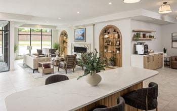 Upscale lobby with coffee bar, fireplace, and co-working space