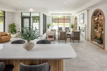 Upscale lobby with coffee bar, fireplace, and co-working space