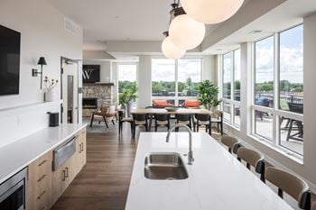 Sky lounge with large warming kitchen, fireplace, seating areas, tv's, fire pits and panoramic lake views