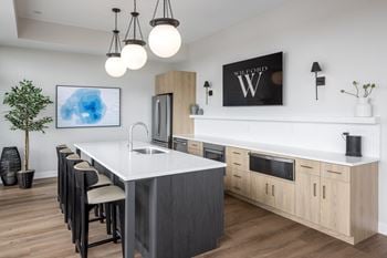 Sky lounge with large warming kitchen, fireplace, seating areas, tv's, fire pits and panoramic lake views