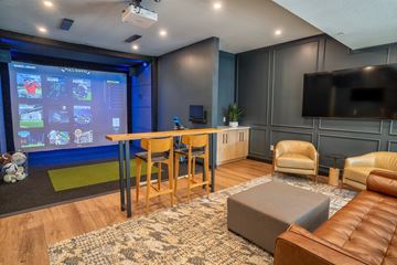 Waconia apartment for rent - A modern living room with a large screen and comfortable seating.