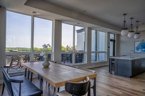 Waconia apartment for rent - A dining room with a wooden table and chairs.