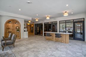Waconia apartment for rent - A spacious interior with a bar area and seating.