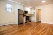 Minneapolis apartment for rent - a kitchen with a refrigerator freezer and a stove top oven