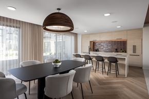 Rosemount apartment for rent - A modern dining room with a large table and chairs.