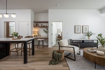 Rosemount apartment for rent - A modern living room with a dining table and chairs.