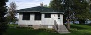 Medicine Lake apartment for rent - a small white house with stairs and a green roof