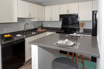 Fitted kitchen with island dining
