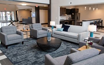 Lakeville apartment for rent - A living room with grey furniture and a black coffee table.
