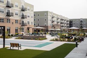 Shoreview apartment for rent - pool and a bench at The Edison at Rice Creek I and II, Shoreview