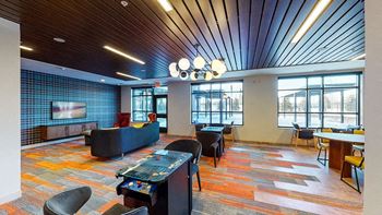 A room with a blue wall and a wooden ceiling.