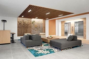 A modern living room with a wooden ceiling and grey couches.