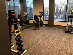 Minneapolis apartment for rent - A gym with a variety of equipment including weights and machines at The Redwell Apartments, Minnesota