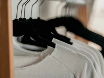 A row of clothes hanging on a rack