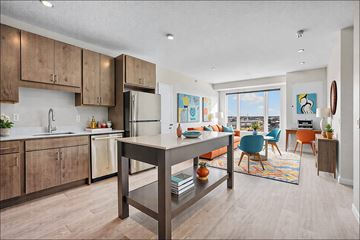 Rosemount apartment for rent - A kitchen with a table and chairs in front of a window.