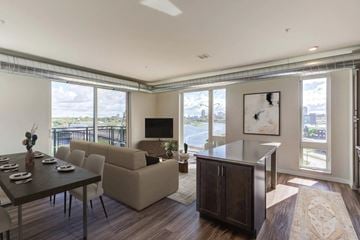 Minneapolis apartment for rent - A modern living room with a dining table and chairs.