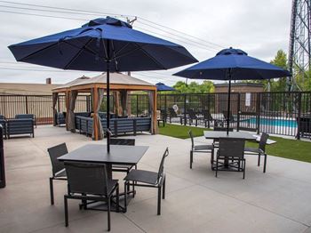 Upii outdoor patio with seating, firepit and cabanas
