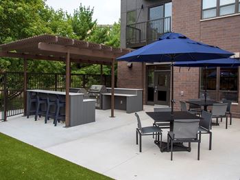 Upii outdoor patio with grilling stations and seating