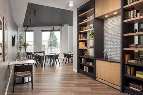 Bloomington apartment for rent - A modern dining room with a long table and chairs.