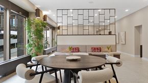 St. Paul apartment for rent - A modern dining room with a round table and chairs.
