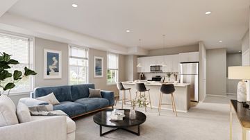 Lakeville townhouse for rent - A modern living room with a blue sofa and a coffee table.