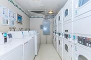 San Jose apartment for rent - A Row Of Washing Machines at Atrium Garden Apartment Homes, LLC, California