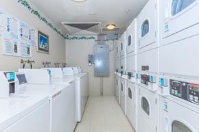 San Jose apartment for rent - A Row Of Washing Machines at Atrium Garden Apartment Homes, LLC, California