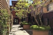 San Jose apartment for rent - A Courtyard With a Tree at Atrium Garden Apartment Homes, LLC, San Jose, CA, 95112