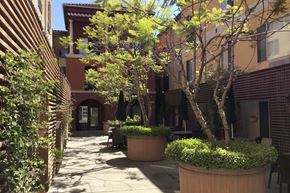 San Jose apartment for rent - A Courtyard With a Tree at Atrium Garden Apartment Homes, LLC, San Jose, CA, 95112