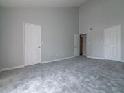 Canoga Park apartment for rent - a bedroom with a carpeted floor and two doors at Warner Center Townhomes, California