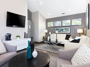 Daly City apartment for rent - a living room with couches a table and a television at Skyline Heights Apartments, Daly City, CA, 94015