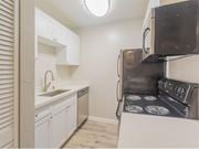 Daly City apartment for rent - a kitchen with a stove and a sink and a microwave at Skyline Heights Apartments, Daly City, 94015