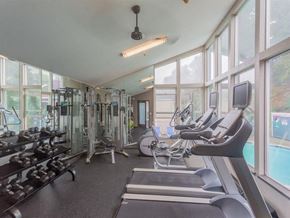 Daly City apartment for rent - a gym with cardio equipment and windows at Skyline Heights Apartments, Daly City, California
