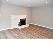 Mill Valley apartment for rent - a living room with a fireplace and wooden floors at Trailhead Apartments at Tam Junction, Mill Valley, 94941