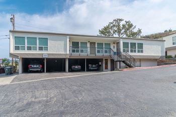 A building with cars parked in front of it