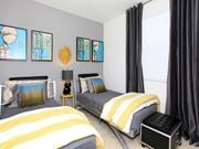 Oxnard apartment for rent - a bedroom with two twin beds with yellow and gray bedding at The Vines at Riverpark, LLC, Oxnard California
