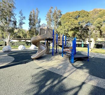 A slide at a playground at a park